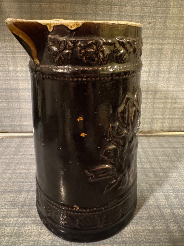 Antique Ceramic Pitcher with raised floral pattern
