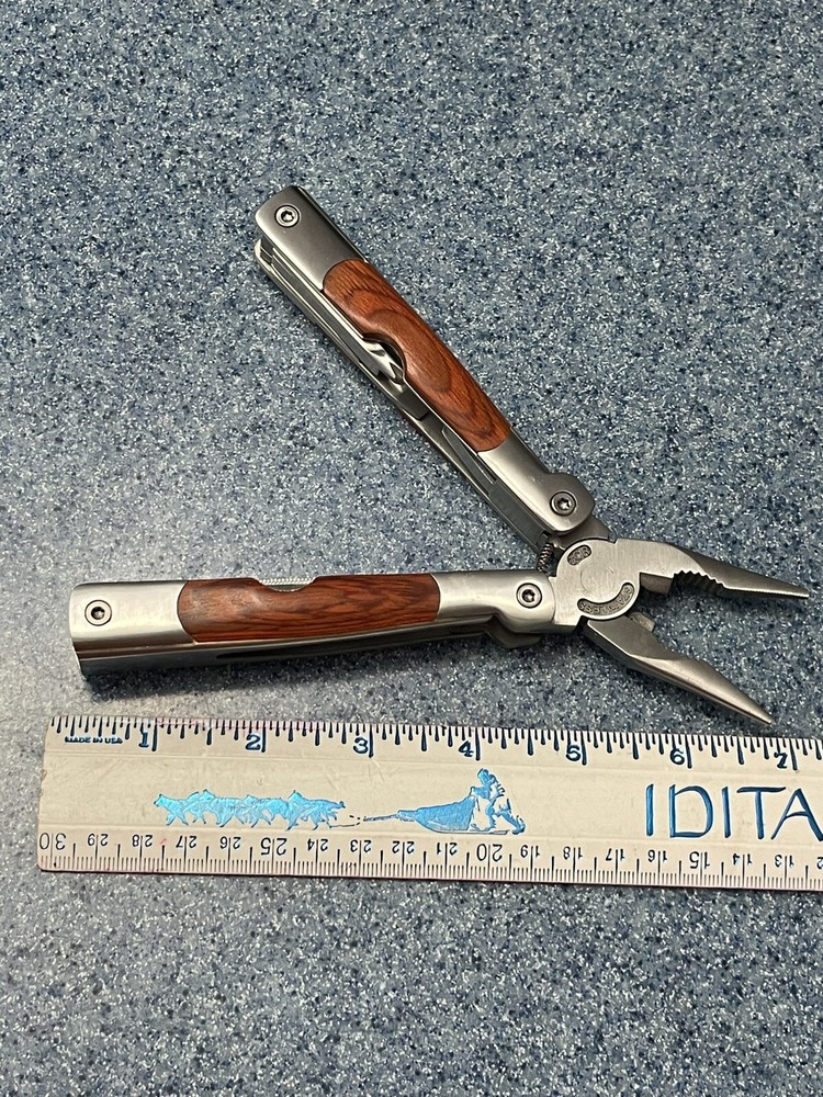 Elk Ridge-Multi Tool With Assorted Tools -pliers -knife-sockets- Bottle Opener