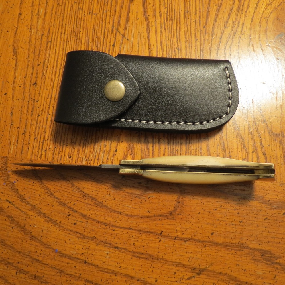 Sleek Damascus folding blade knife with white bone & leather sheath hand made