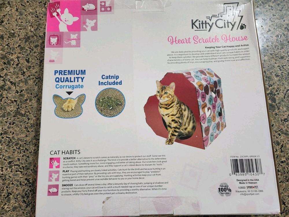 kitty scratching heart shape house