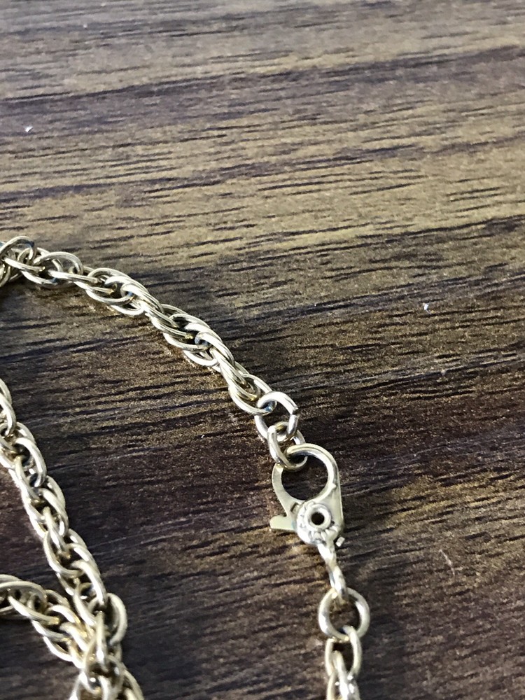 Monet Gold tone Necklace with round Pattern Pendant