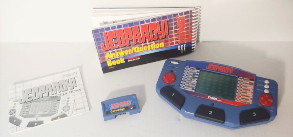 Jeopardy Handheld Electronic Game Complete with Answer/Question Book & Cartridge