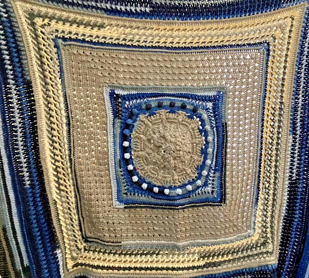 handmade, textured crocheted afghan