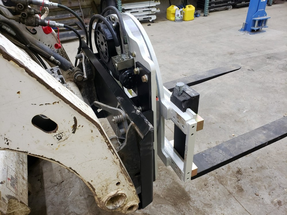 Skidsteer Bobcat fork rotator--- NEW WITH WARRANTY!!!