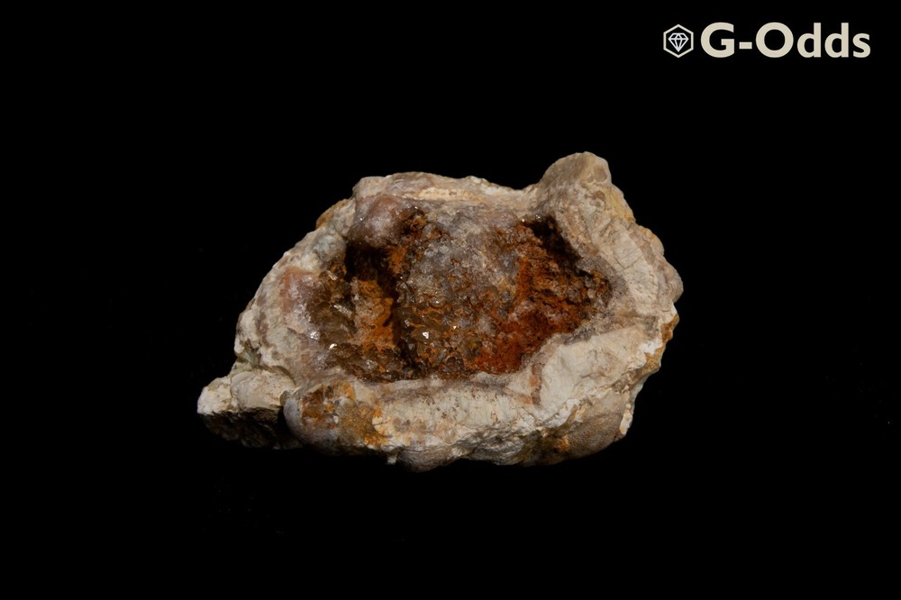 Rare broken geode around 2" with iron oxide and quartz