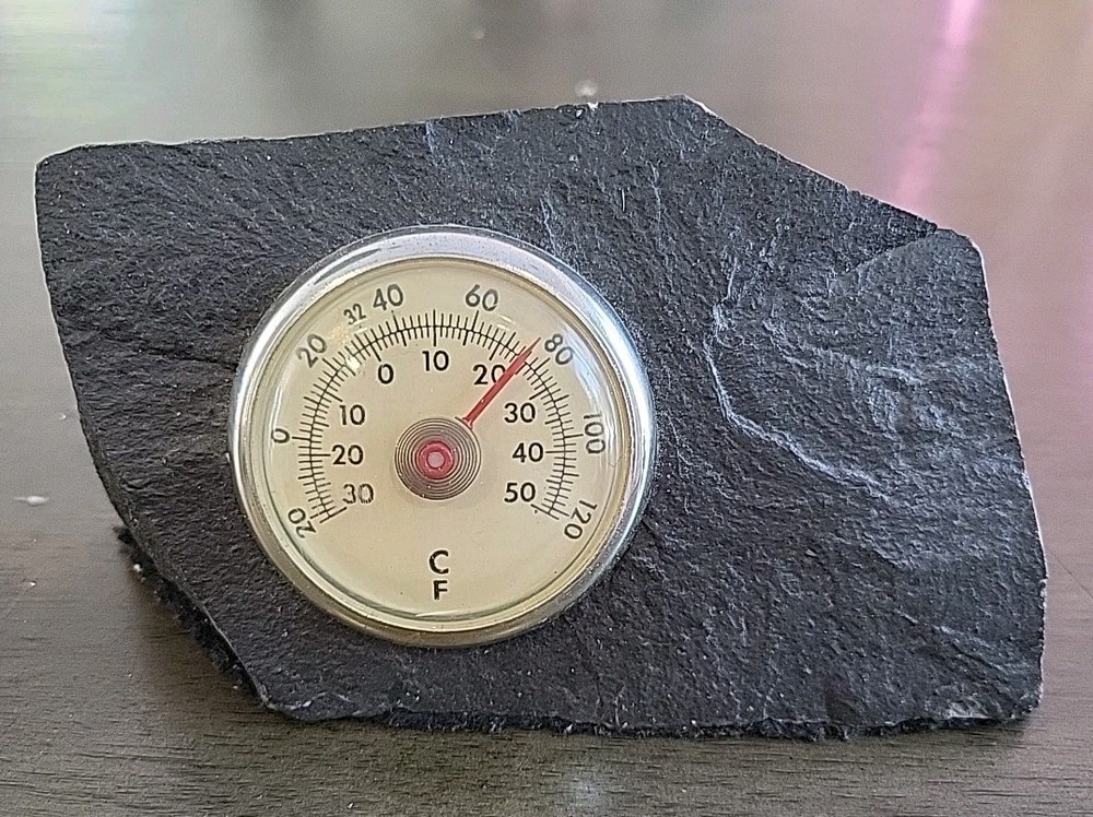 Vintage Desktop Thermometer on Jagged Stone.