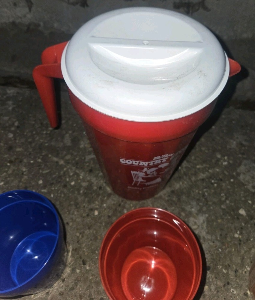 McNess Country Store. Plastic Pitcher And 4 Plastic Cups