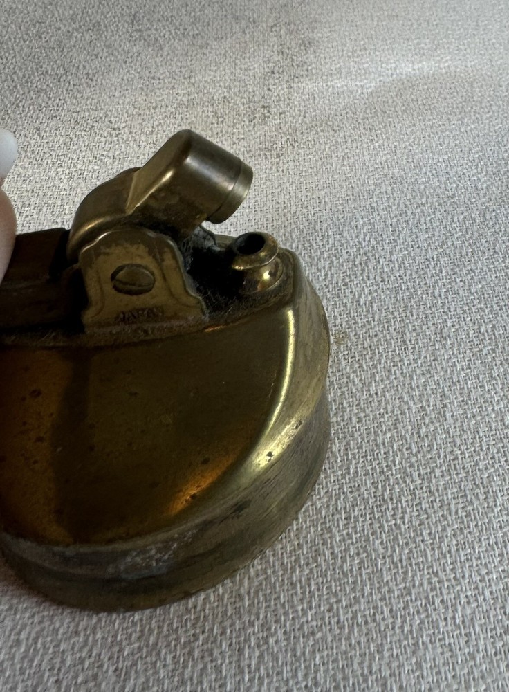 Brass Table lighter with crest/ rifle & sword motif
