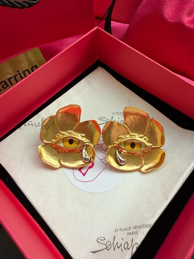 Schiaparelli flower yellow eye earring