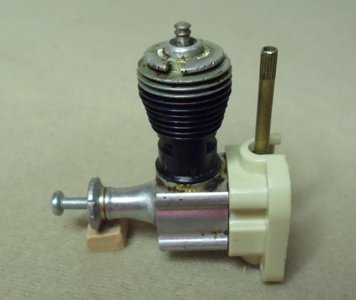 Cox .049 Glow Engine With a White Radial Mount.