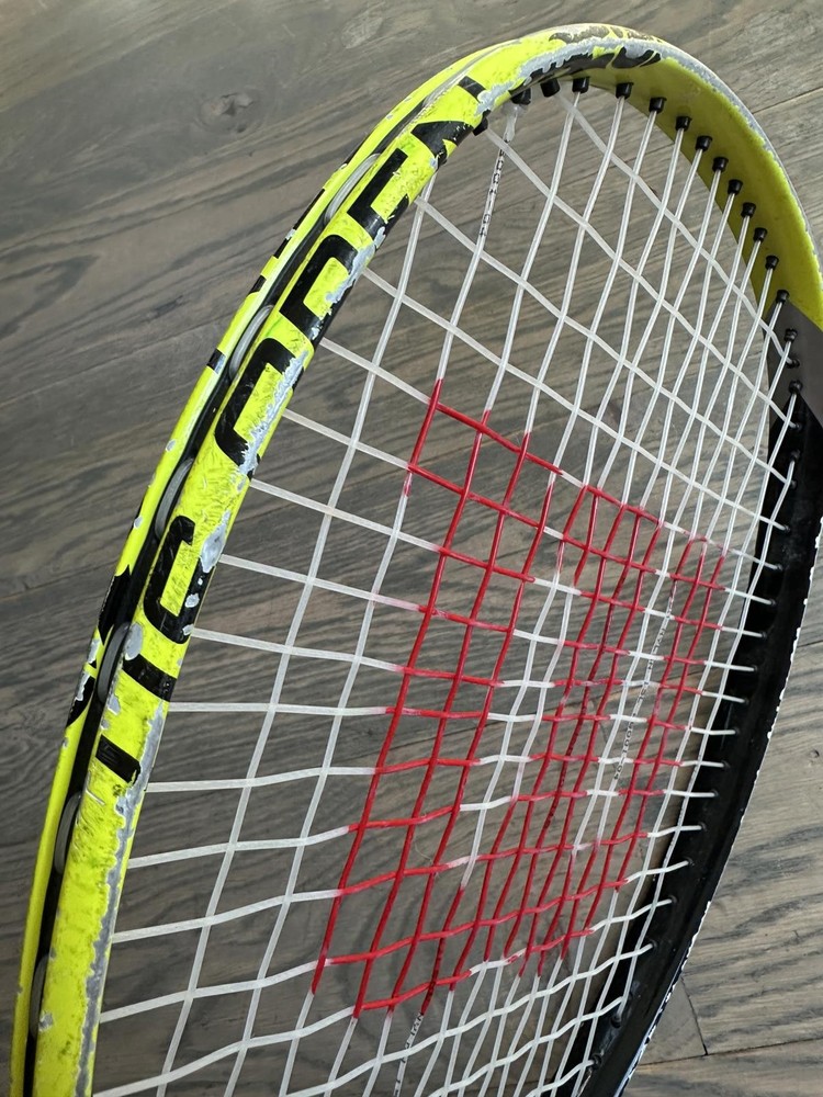 Wilson Tennis Racquet with Red String Pattern