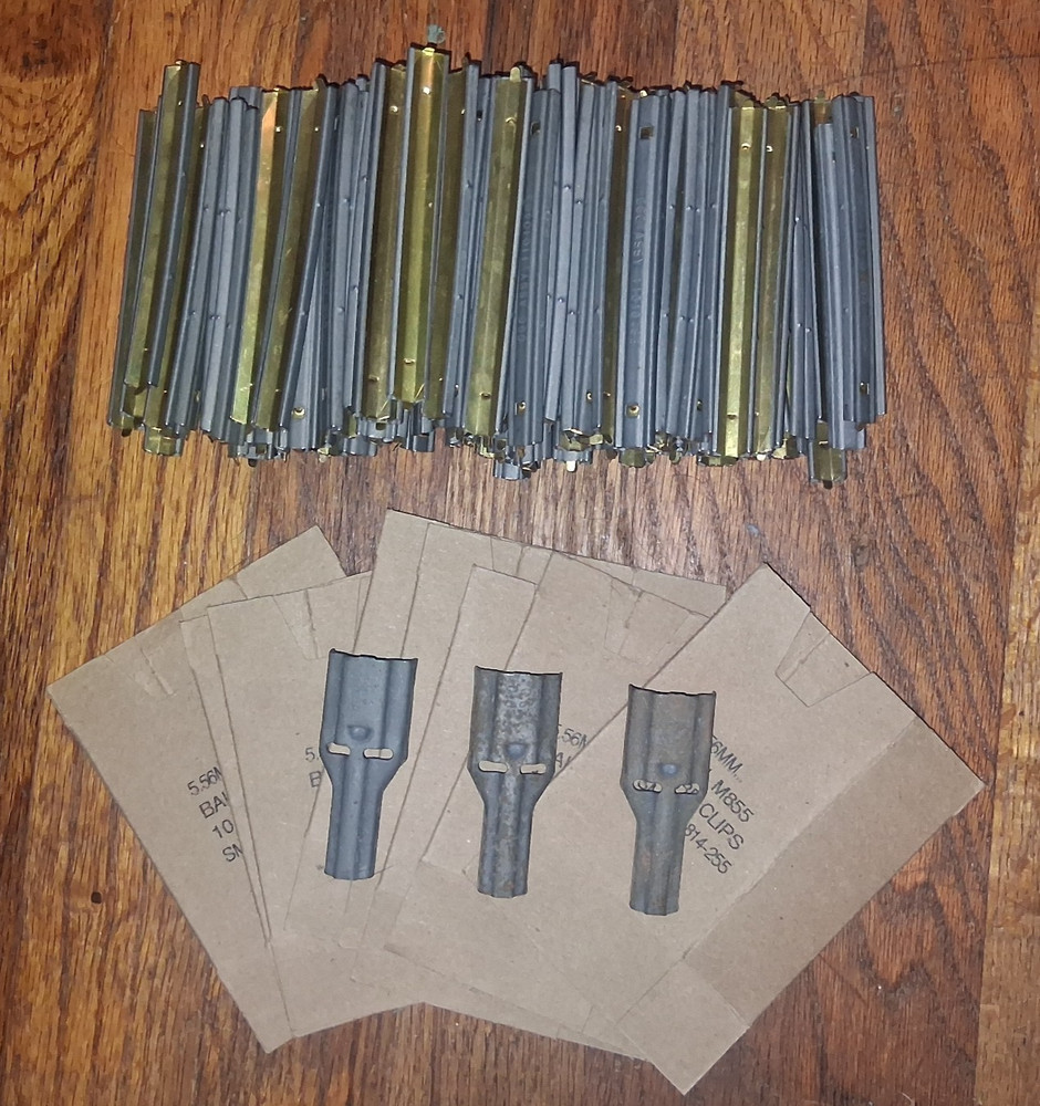 142 USGI stripper clips, 3 spoons, 9 sleeves