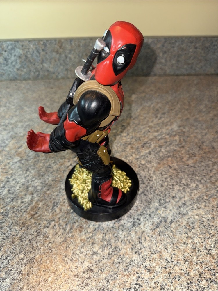 Deadpool controller/phone holder. Marvel Cableguys. Good shape. About 9 " High.