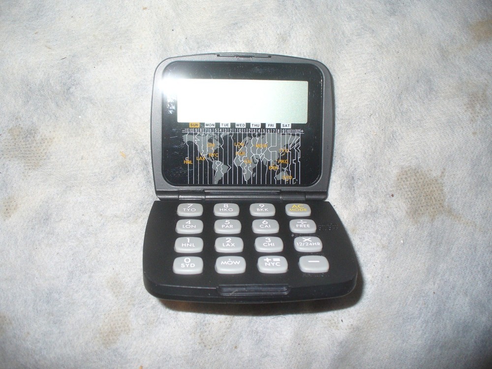 Vintage Brookstone Folding World Clock Calculator