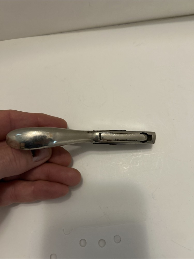 Vintage hole punch with spring handle action and adjustable punch depth guide
