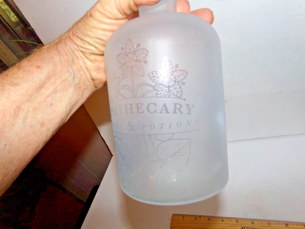 FLOSTED GLASS BOTTLE WITH STOPPER HAS WORDS ETCHED