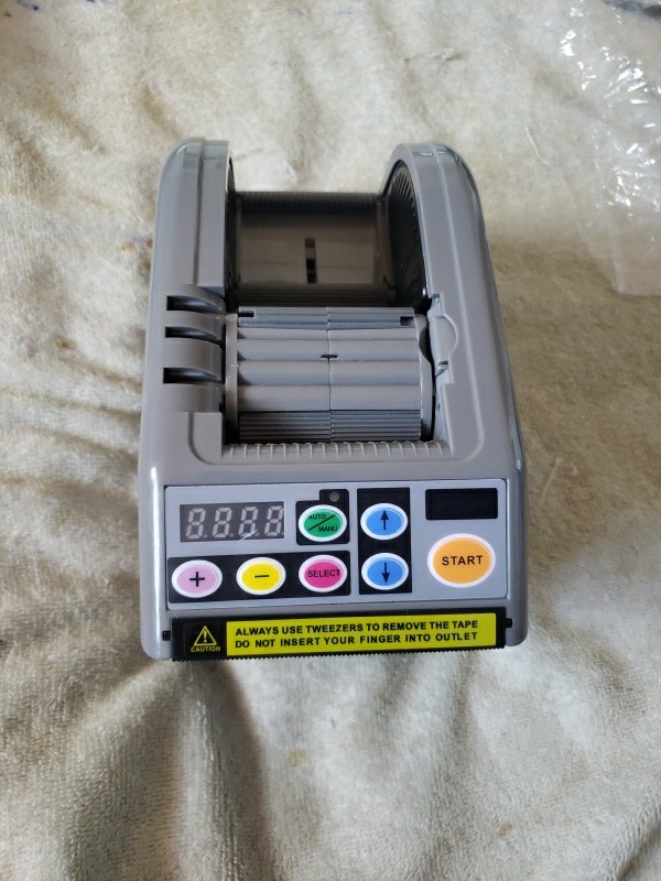 RT-7000 AUTOMATIC TAPE CUTTING MACHINE