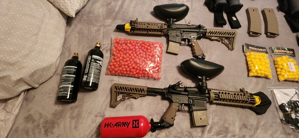 2 paintball guns with accessories