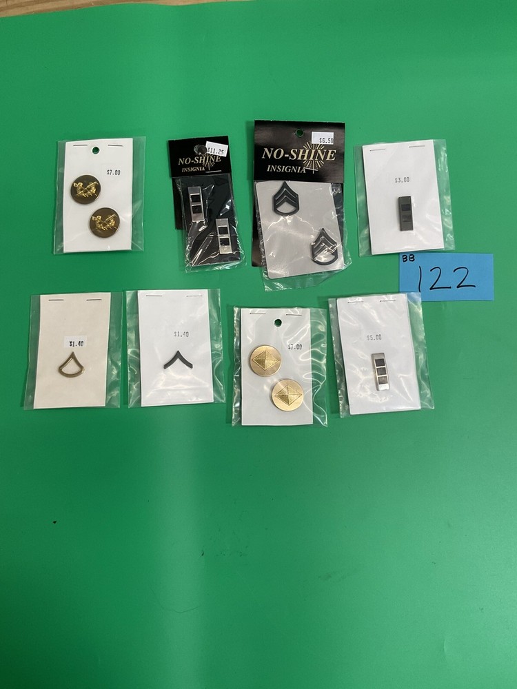large lot of pin back NOS insignia bb122