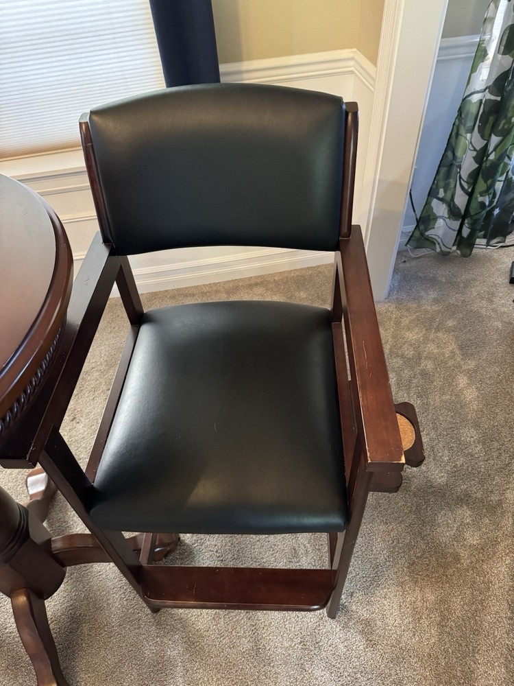 Pub table with kind of leather stools from Costco.