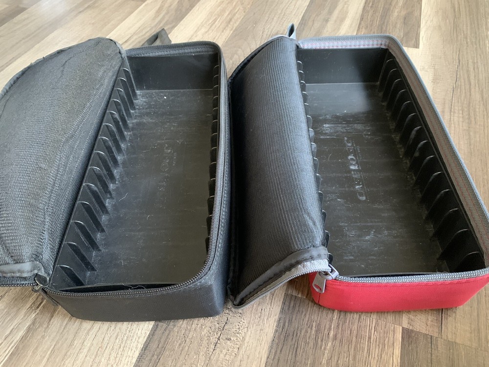 2- Case Logic 15-Cassette Cases (one Red, One Black)