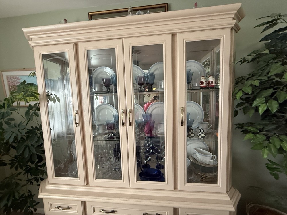 dining room set 6 chairs and lighted hutch ,table has leaf stored inside