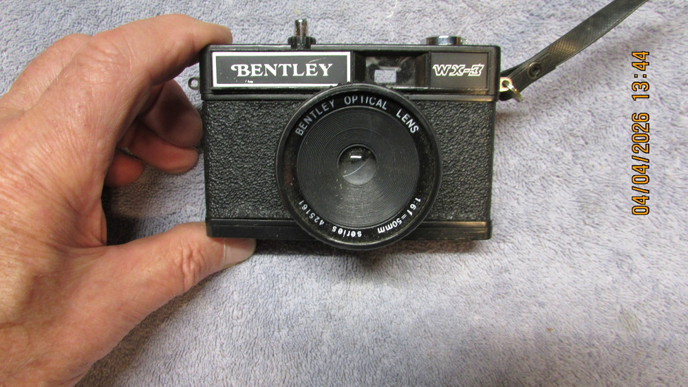 3 vintage cameras.