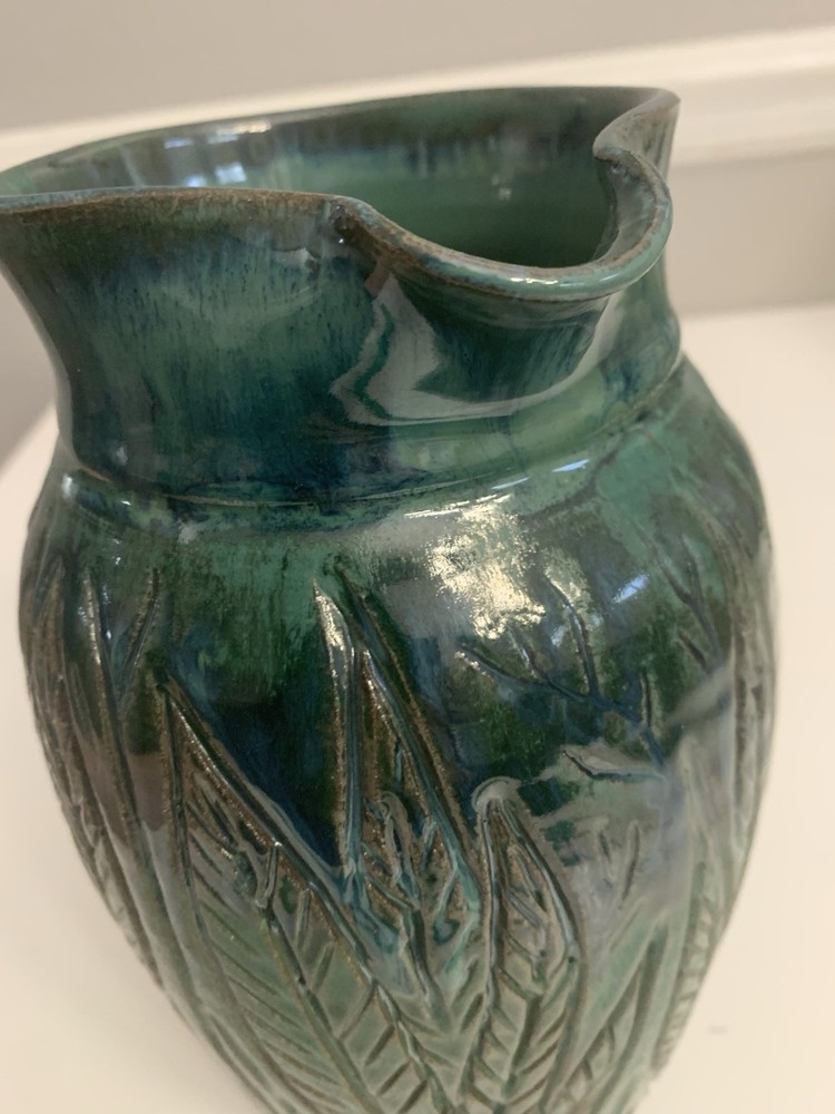 Signed Handcrafted Pottery Pitcher W/ Teal Green Glaze & Raised Leaf Pattern