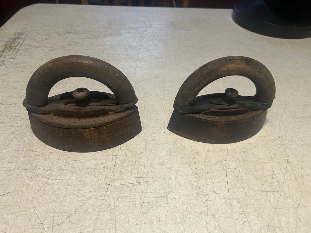 2 OLD SAD IRONS