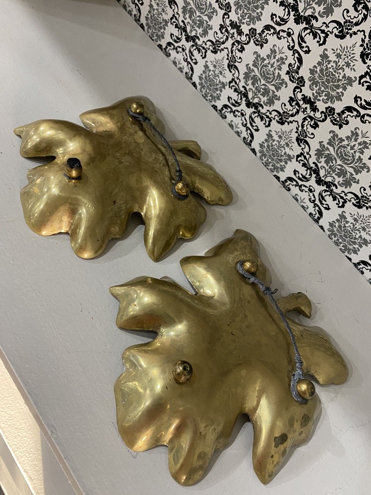 two beautiful solid brass leaf design wall decor. 7 inches tall.
