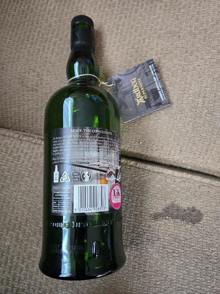 Ardbeg Supernova 2009 empty bottle and brochure