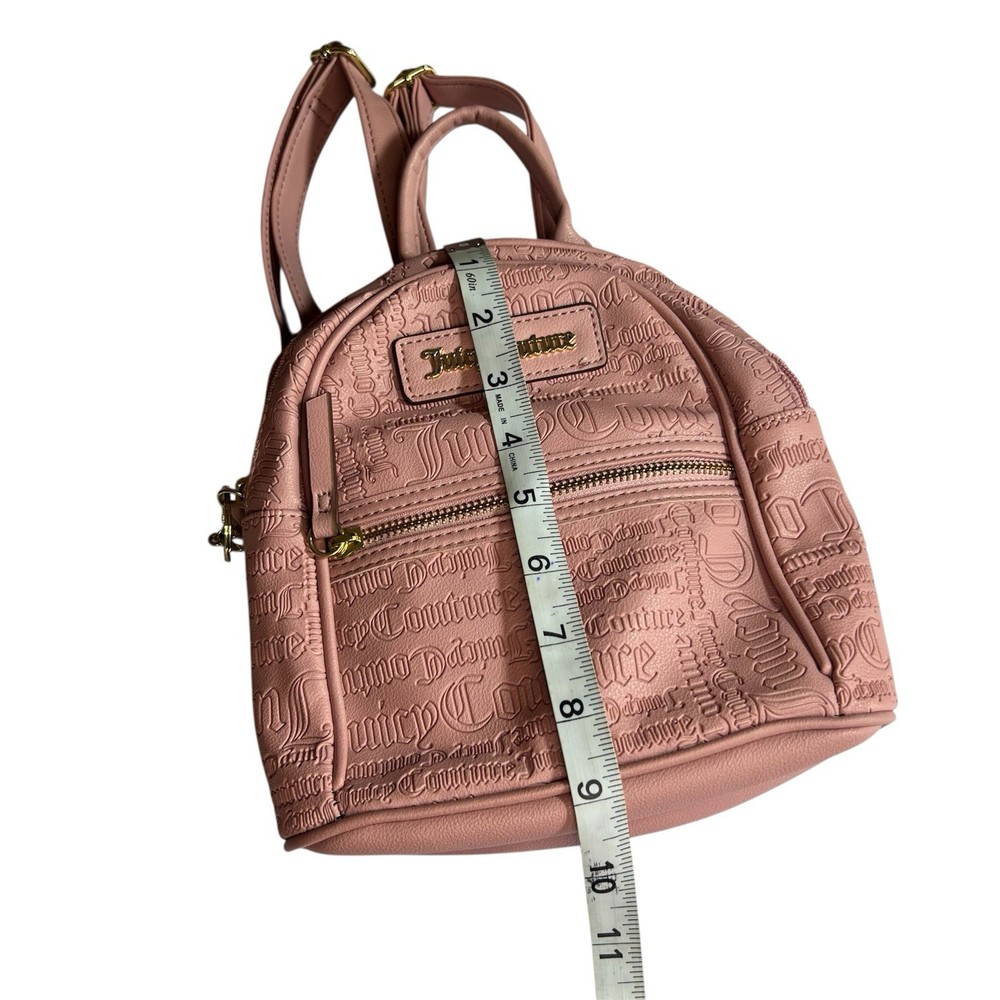 Backpack Elegant Juicy Couture backpack in blush. Embossed logo design. Includes