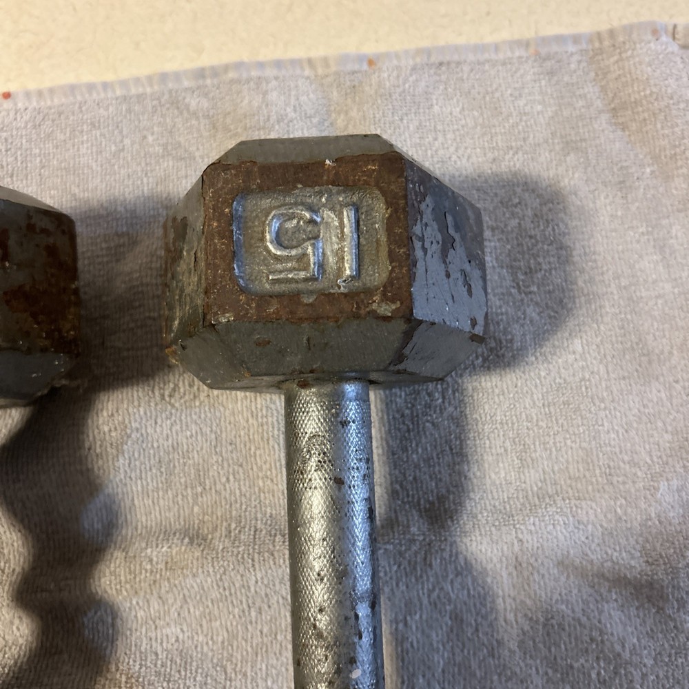 Three 15 Pound hex Head Cast Iron Dumbbells Silver