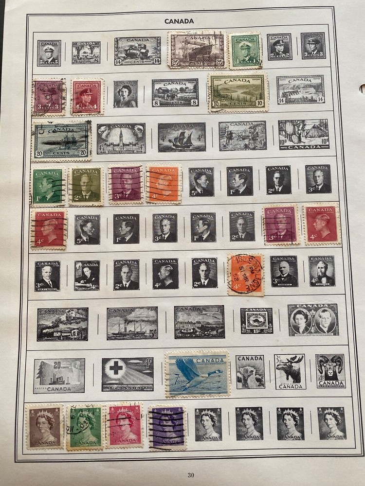 Worldwide Canada Stamps hinged on pages