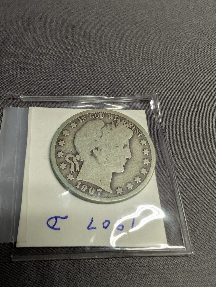 Two 1907 Barber Liberty Half Dollar Coins.