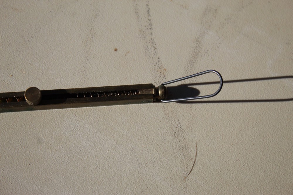 Brass straight-line percussion capper