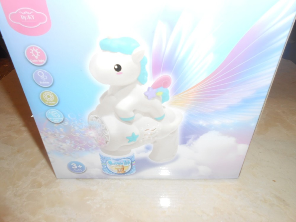Blue Unicorn Bubble Gun Blower in box.
