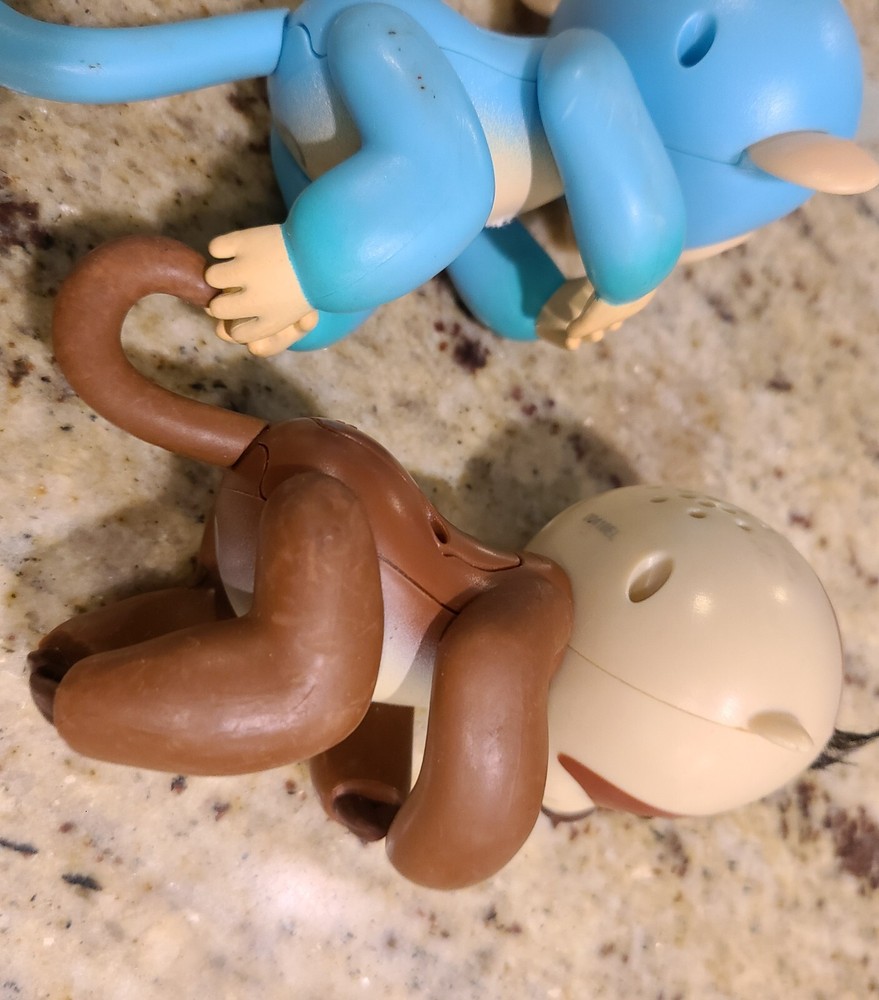 2 Fingerlings Interactive Baby Monkey Blue Brown Toys. Both work tested.