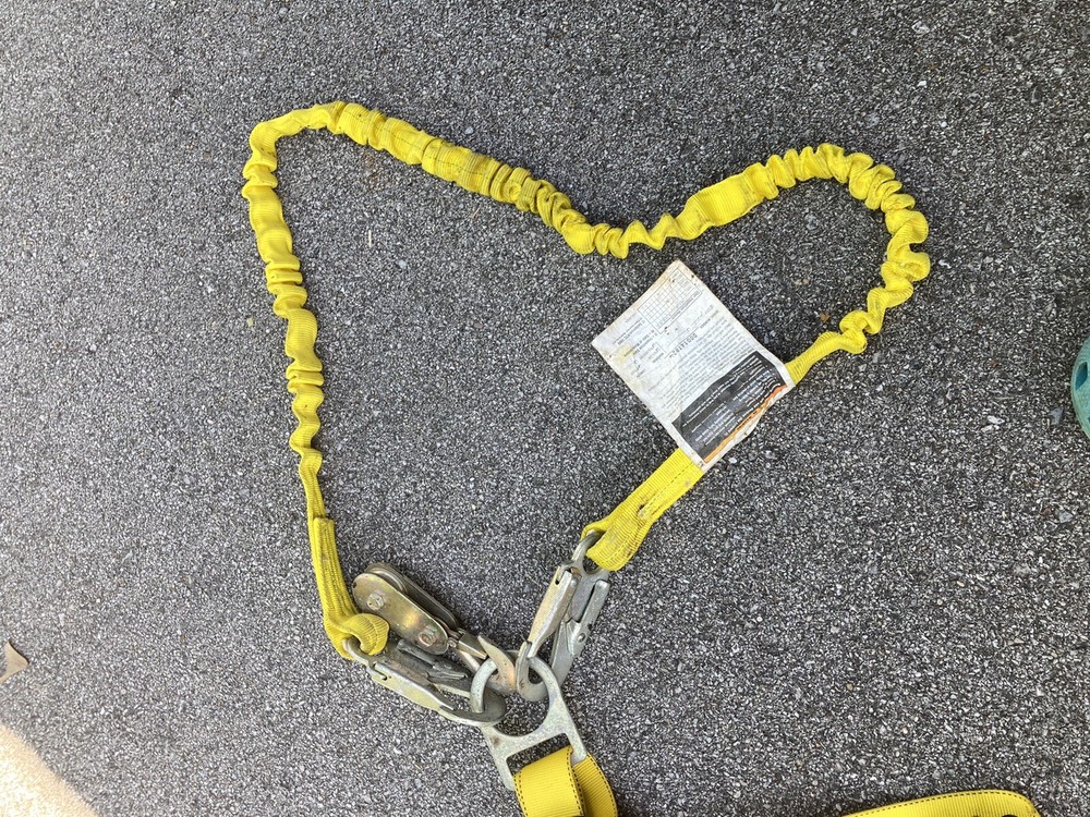 safety harness with strap attached