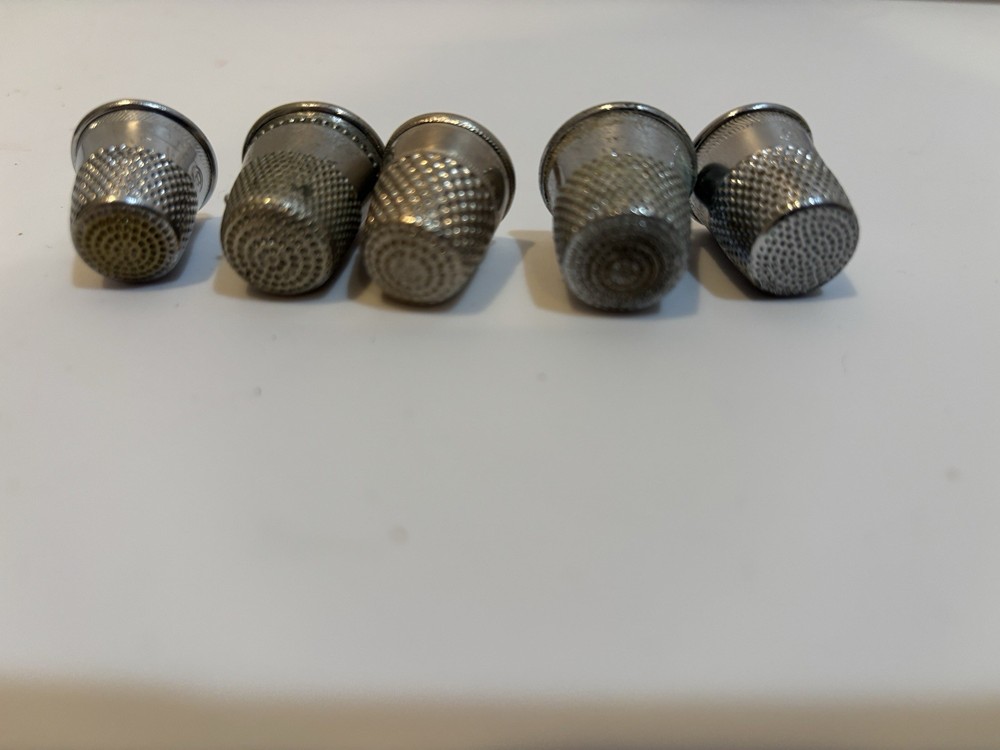 Five thimbles. Sizes 8, 9, 9,10,11