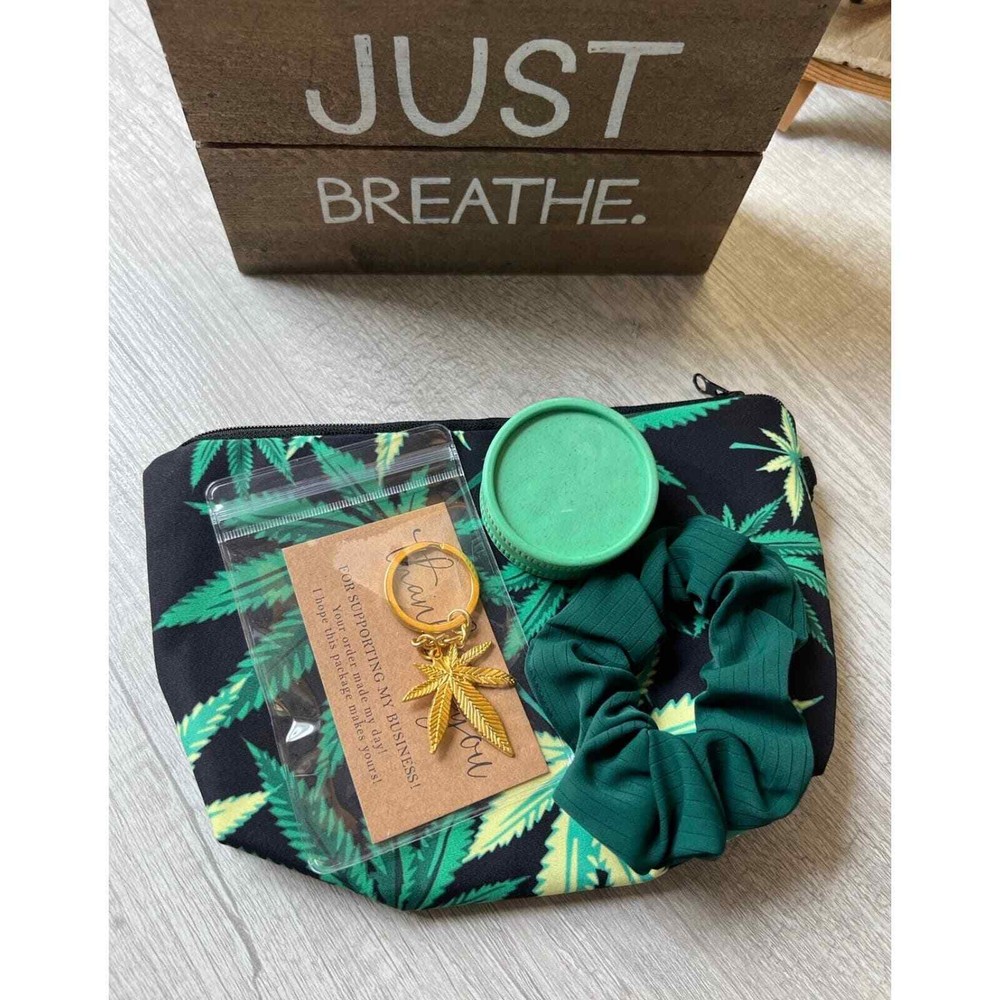 Leaf cosmetic bag with keychain and scrunchie.