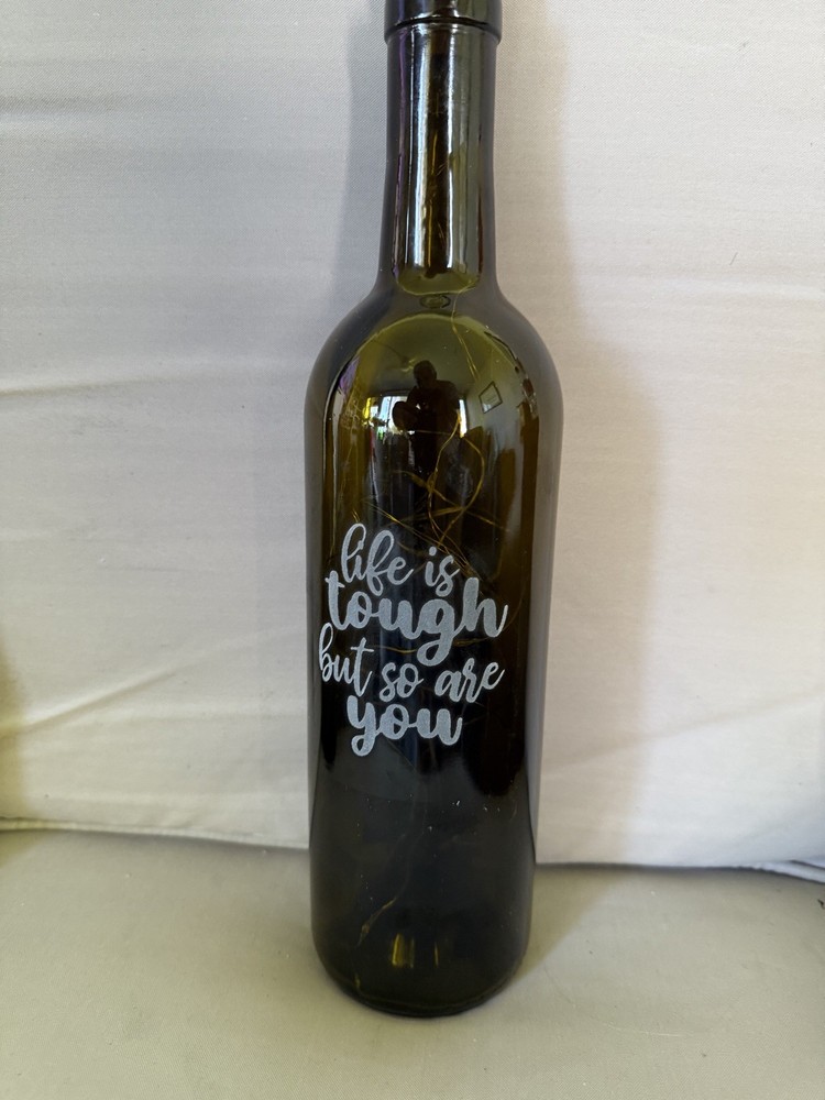 Lighted wine bottle with on/off switch in cork.