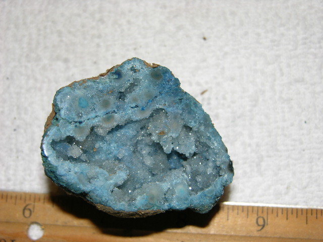 Geode cut & polished half with colored crystal center 2.5 inch E65