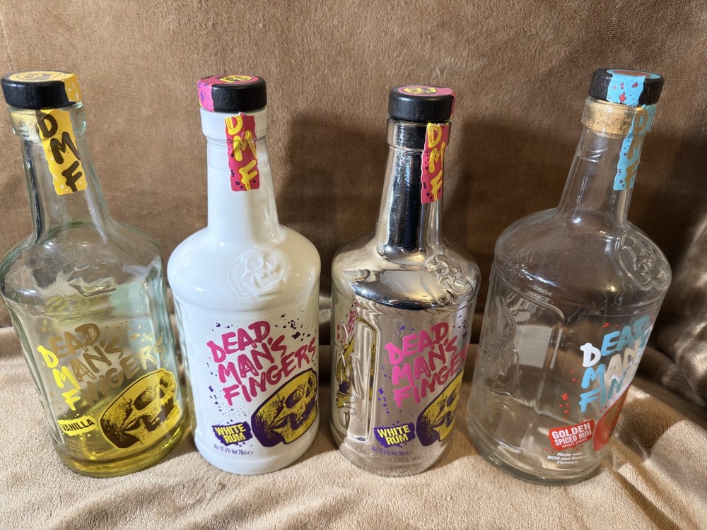 4 EMPTY RUM BOTTLES DEAD MAN'S FINGERS
