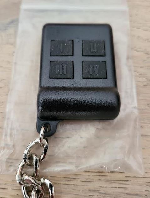 Directed Electronics (DEI) Remote Control 484T 4-button Red LED Indicator
