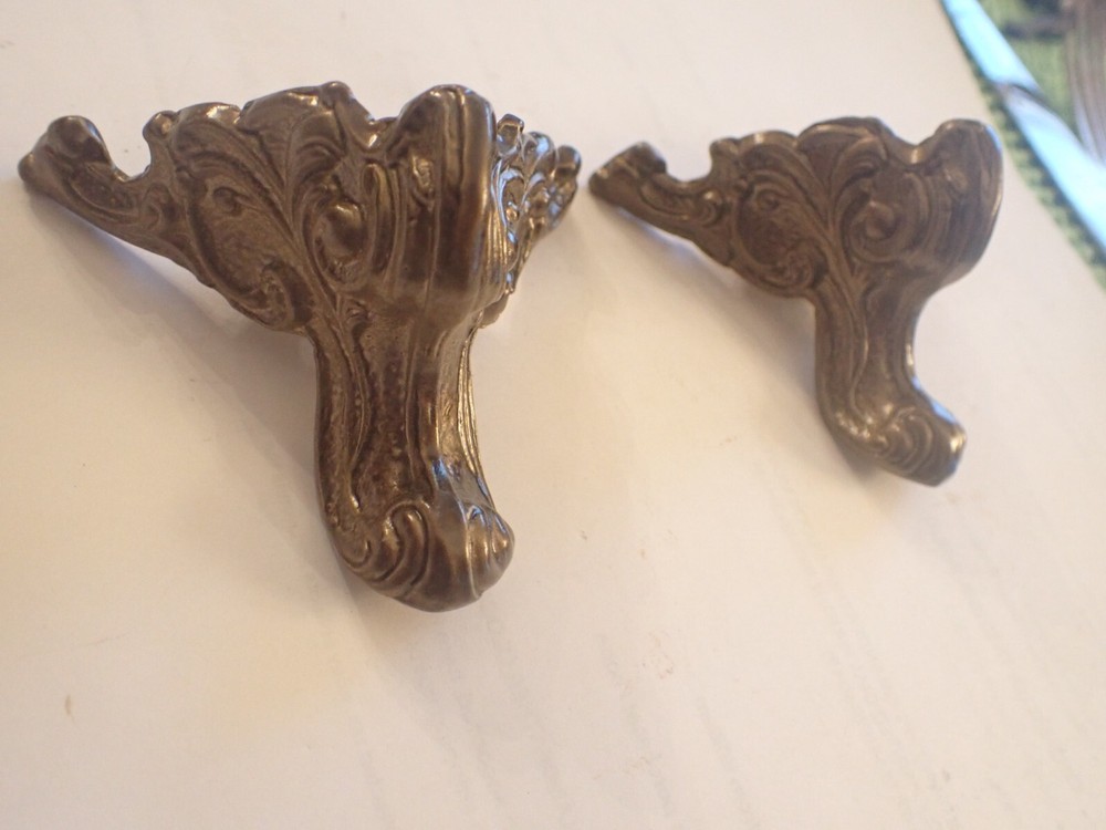 TWO FRONT FEET FOR BLACK MANTEL CLOCK