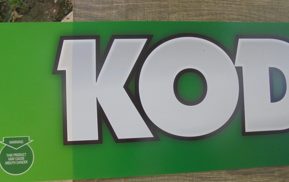 KODIAK-WORKS FOR ME- THIN PLASTIC SIGN 34X8.5"