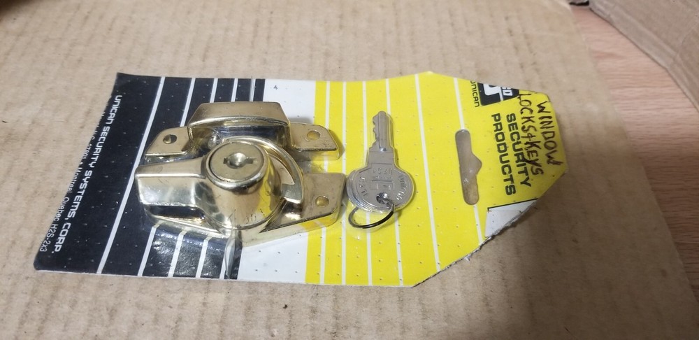 ilco Unican Security Products Brass Security Window Lock. NOS-Damaged packaging
