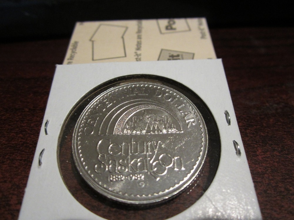 1982 - Saskatoon, SK - 100 years - boat - Commemorative - Canada Trade Dollar