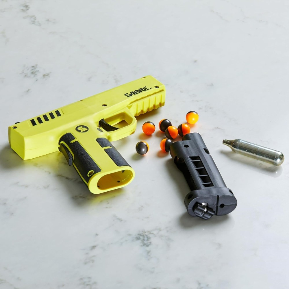 Compact Home Defense Pepper Launcher – 7 Projectiles & Quick CO2 Reload System